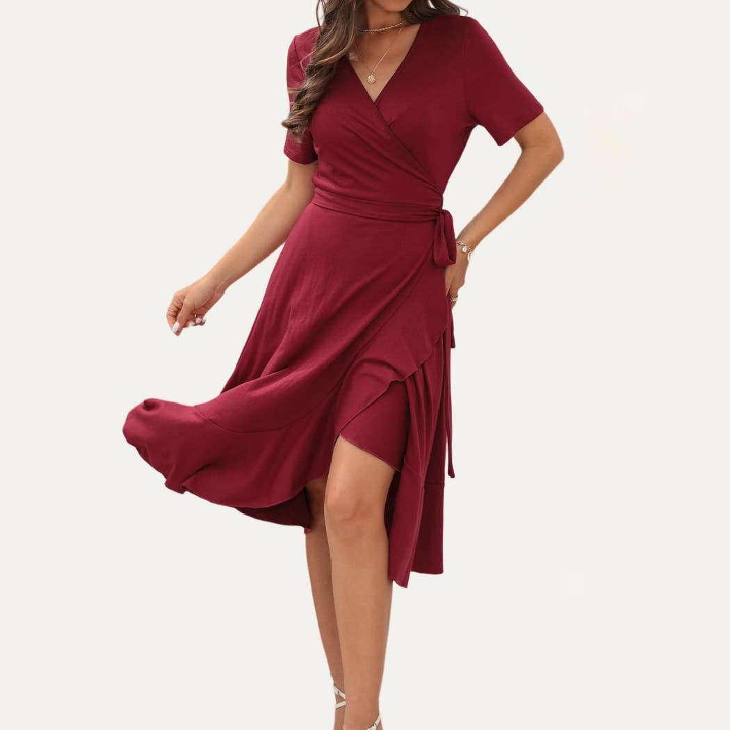 Red wrap dress worn by a model on a white background